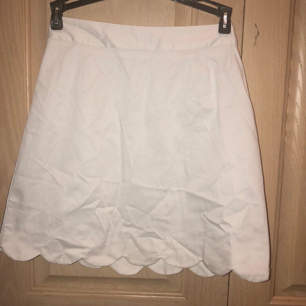 White skirt with scalloped trim